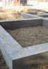 Какие правила укладывания монолитного бетонного фундамента?
